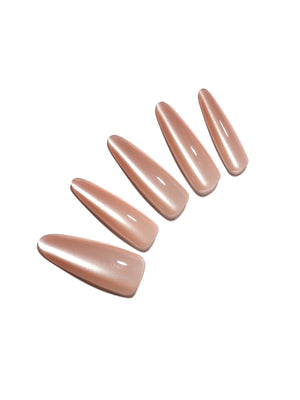 Set of nude-colored nail polish on a white background
