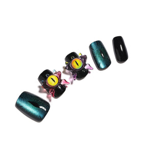 Night Watcher short square black press-on nails with teal cat eye shimmer and 3D eye charms 30-piece set