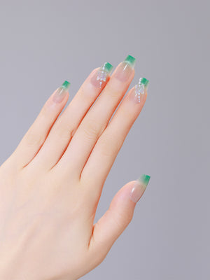 Both hands showing Garden Grace long coffin green French tip PMMA acrylic press-on nails