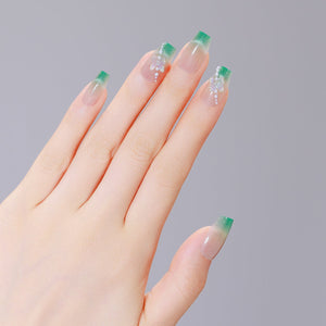 Both hands showing Garden Grace long coffin green French tip PMMA acrylic press-on nails