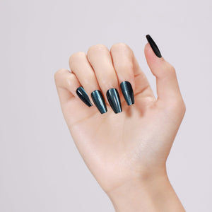 Hand wearing Midnight Kiss long coffin midnight blue metallic press-on nails