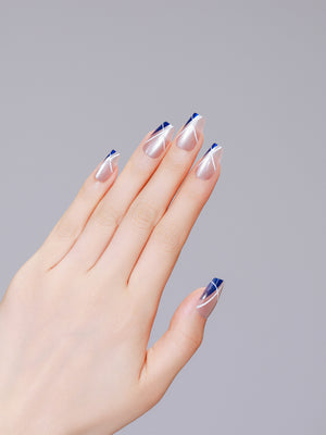 Both hands showing Sapphire Angle medium coffin navy French tip press-on nails glossy finish