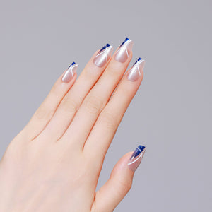 Both hands showing Sapphire Angle medium coffin navy French tip press-on nails glossy finish