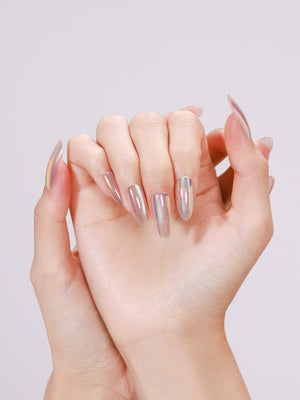 Hands wearing Mirror Dust long almond mirror chrome press-on nails with rainbow shift