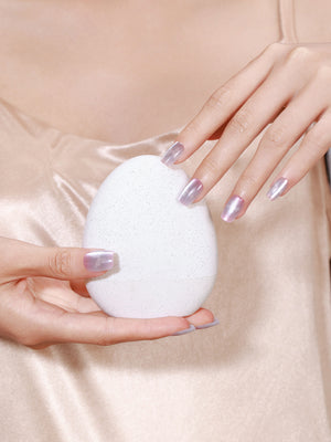 Hand wearing Frosted Butterfly pastel butterfly French press on nails with soft glitter finish