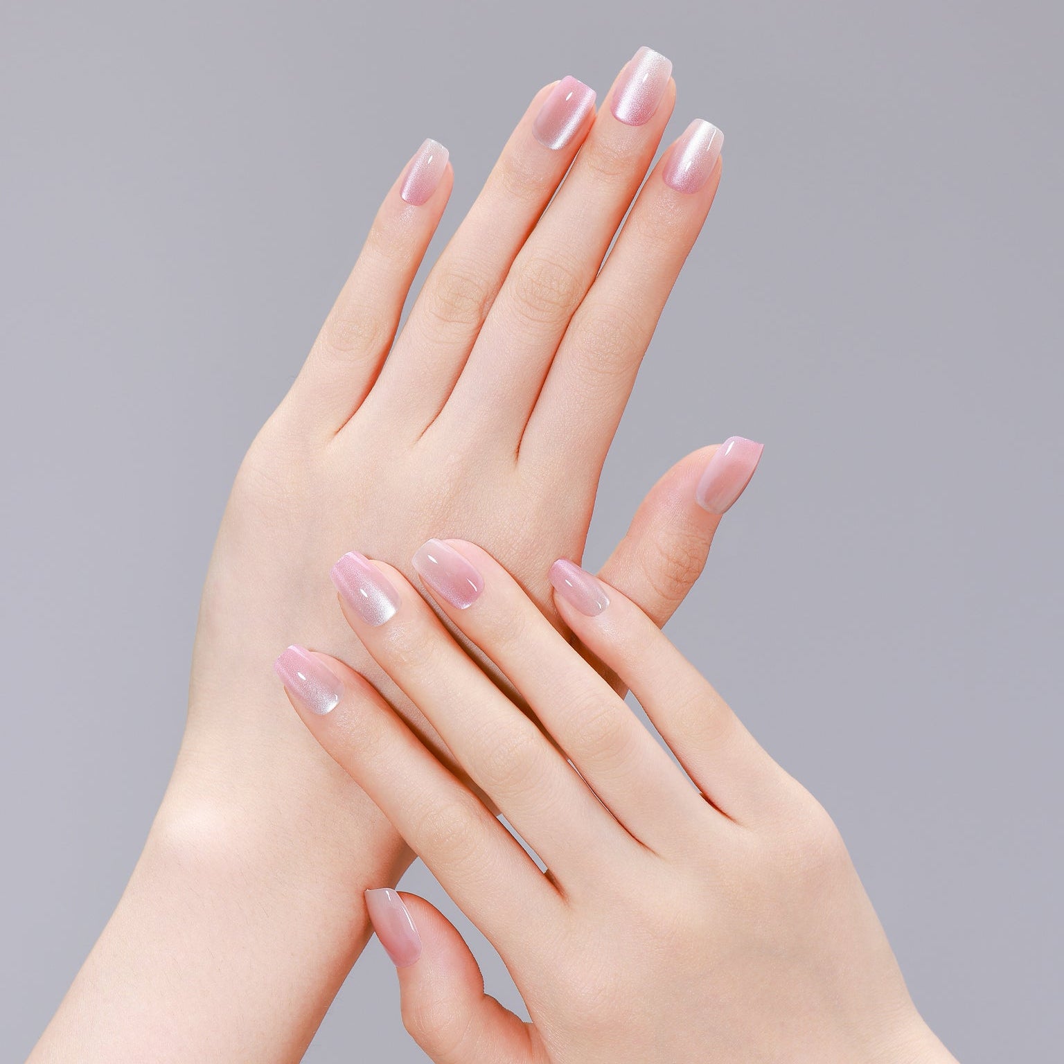 Hand wearing Peach Slush multicolor peach square press-on nails with glossy gel finish