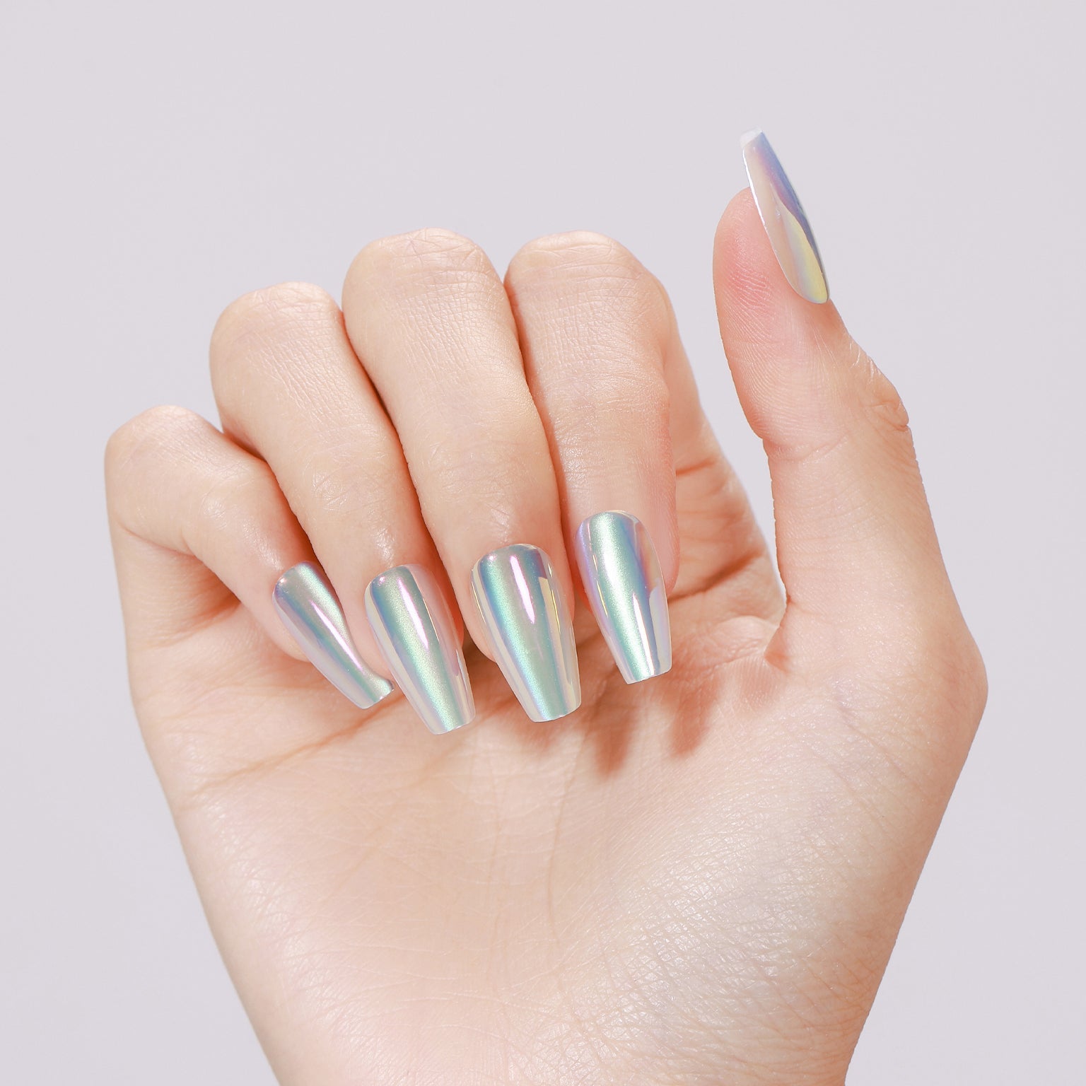 Hand wearing baby blue metallic coffin press-on nails with high-shine chrome finish