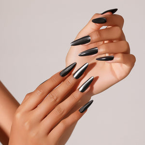 Close-up Witching Hour black chrome stiletto press-on nails high gloss metallic finish