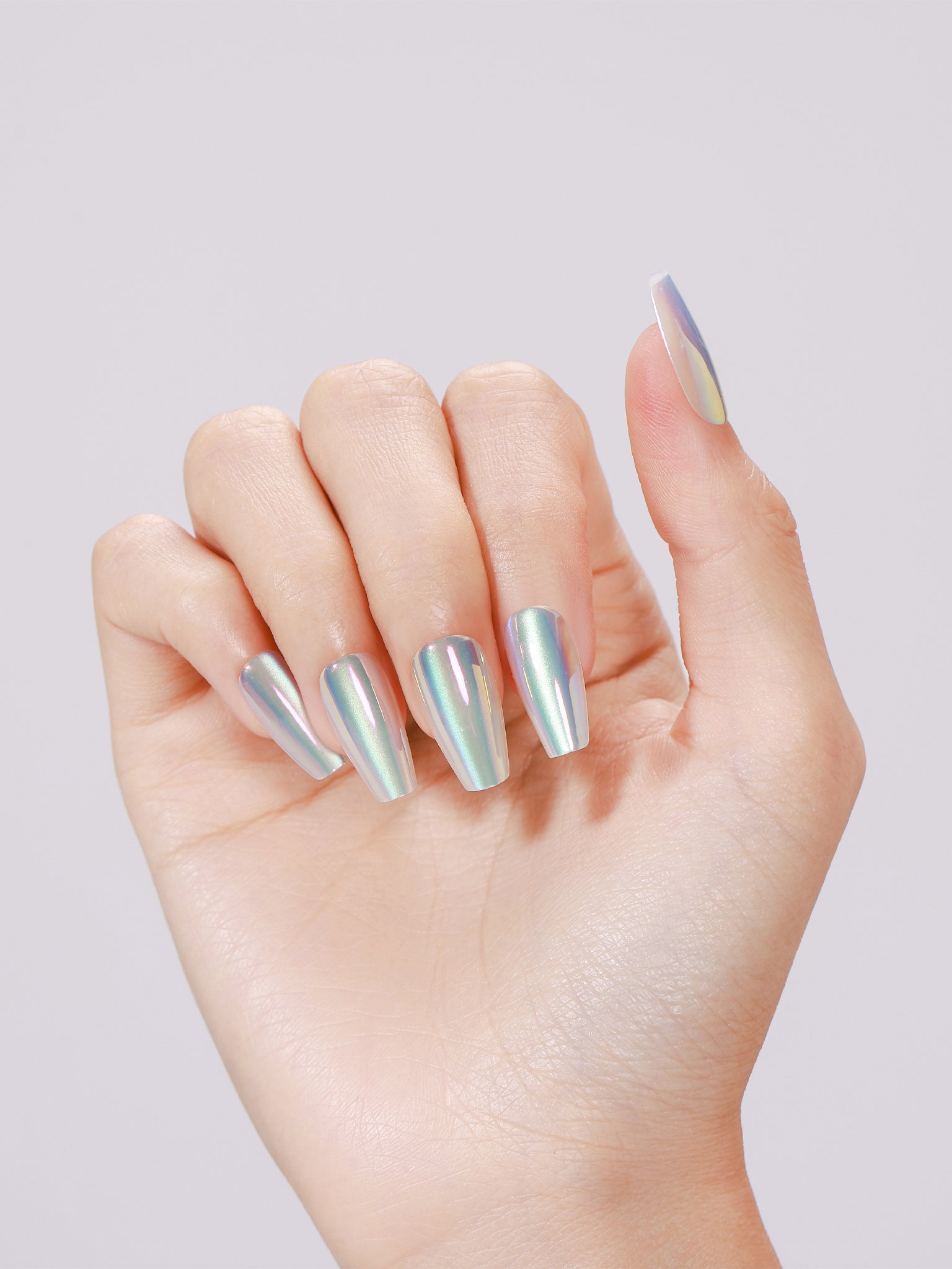 Hand wearing Aurora Ice long coffin iridescent mint-blue chrome press-on nails