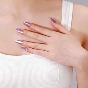 Hand on chest showing long oval metallic lavender press-on nails from ShadePax