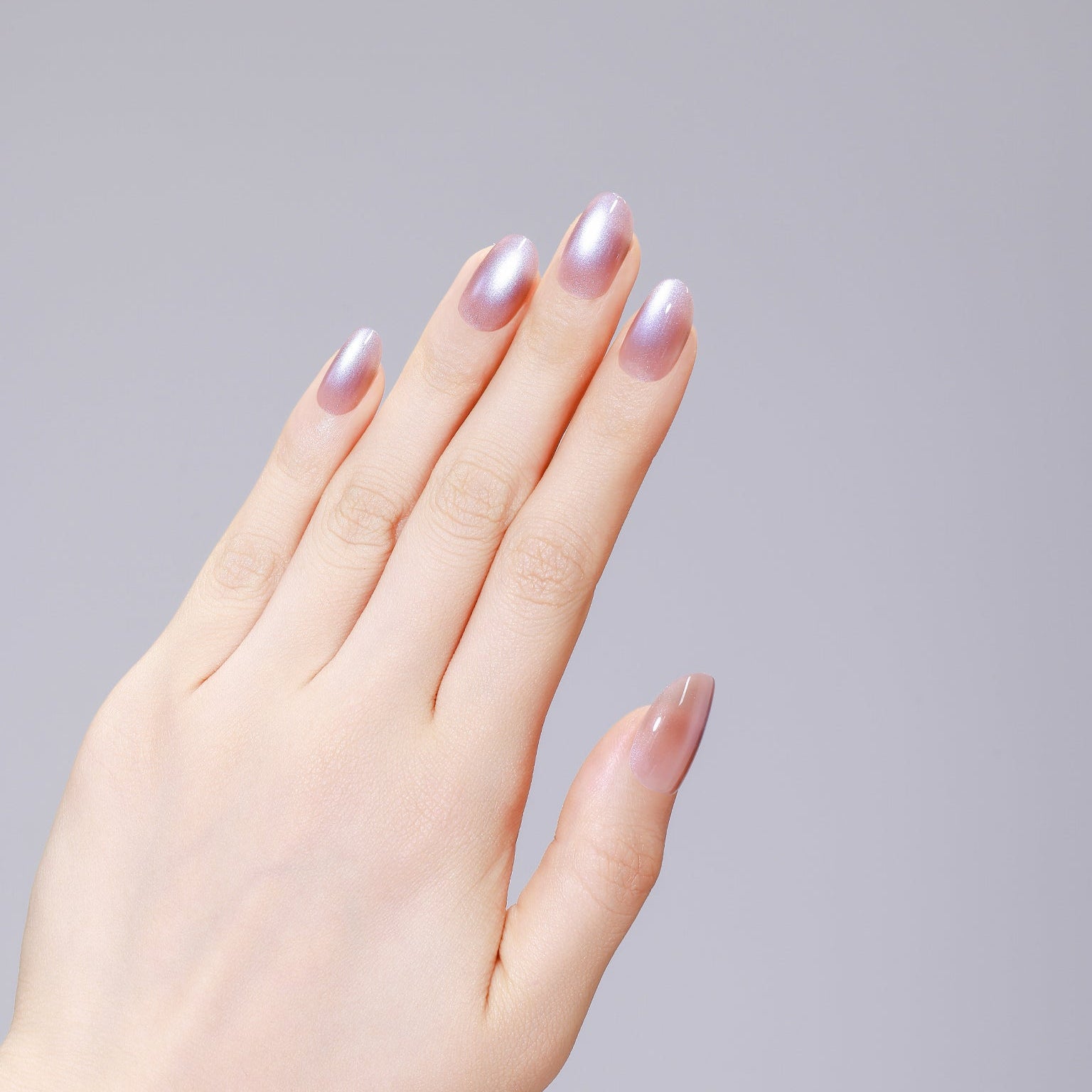 Long oval lavender nude press-on nails with glossy gel finish