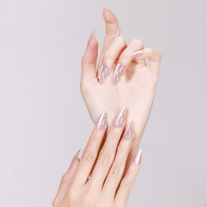 Hands wearing Silk Sketch sheer nude glossy press-on nails with white diagonal lines