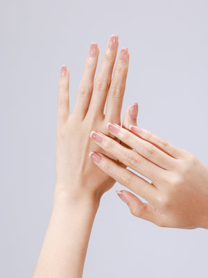 Closeup of Nude Illusion nude ombre acrylic press-on nails in short square shape