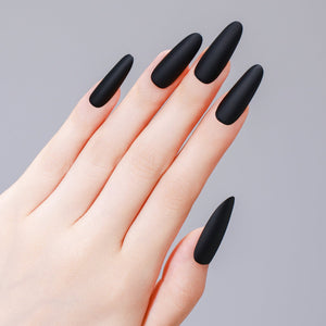 Close-up of long oval matte black PMMA acrylic press-on nails from ShadePax