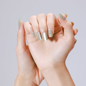 Applying Matcha Latte matcha green press on nails at home using glue and adhesive tabs