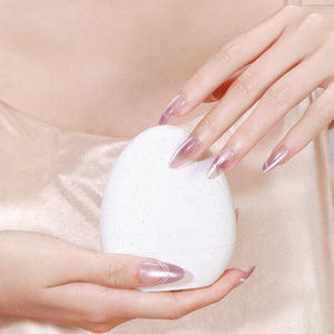 Both hands showing Butterfly Kiss long almond pearly nude press-on nails glossy finish
