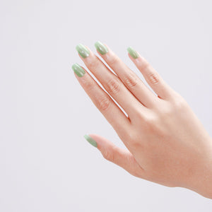 Salon-quality mint green press-on nails applied at home