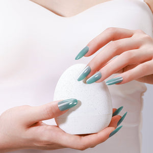Close-up of Glacier Teal long oval sea-glass teal gel finish press-on nails