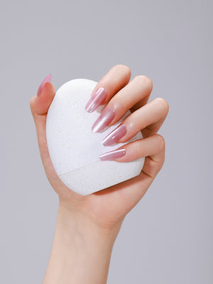 Close-up of Pink Cloud long oval pink acrylic press-on nails with salon-grade gel shine