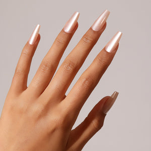 Close-up Silken Petal pearl nude coffin press-on nails glossy finish