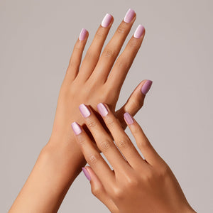 Hand wearing Lavender Haze square milky lavender press-on nails clean minimalist manicure