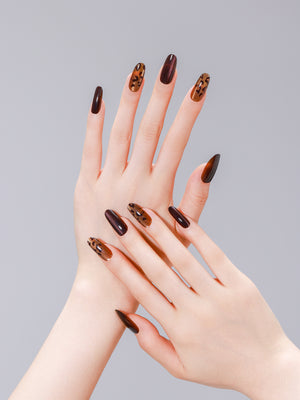 Close-up of brown and gold leopard cat eye PMMA acrylic press-on nails from ShadePax