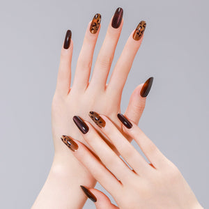 Close-up of brown and gold leopard cat eye PMMA acrylic press-on nails from ShadePax