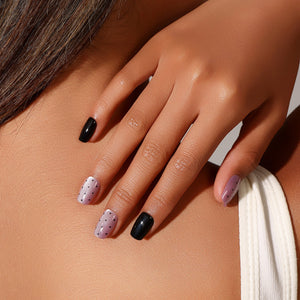 Full set showing Dot Me Darling short square polka dot press-on nails lavender and black design