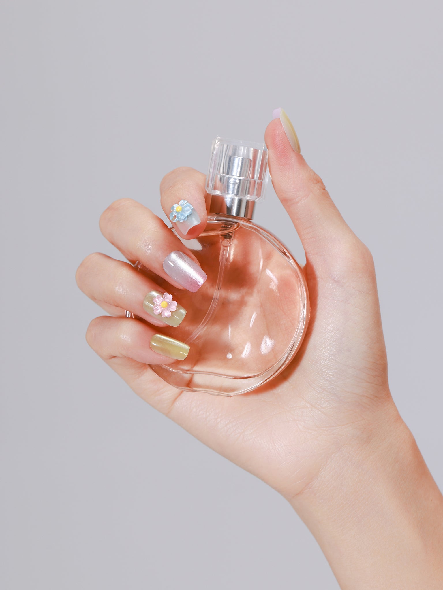 Pastel mint yellow and pink square press on nails with pearly shimmer finish and 3D nail art