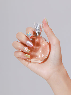 Pastel mint yellow and pink square press on nails with pearly shimmer finish and 3D nail art