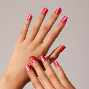 Flat lay Hot Pink Rush press-on nails hot pink cat eye shimmer and coral red accent design set