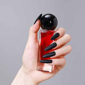 Close-up of long oval matte black PMMA acrylic press-on nails from ShadePax