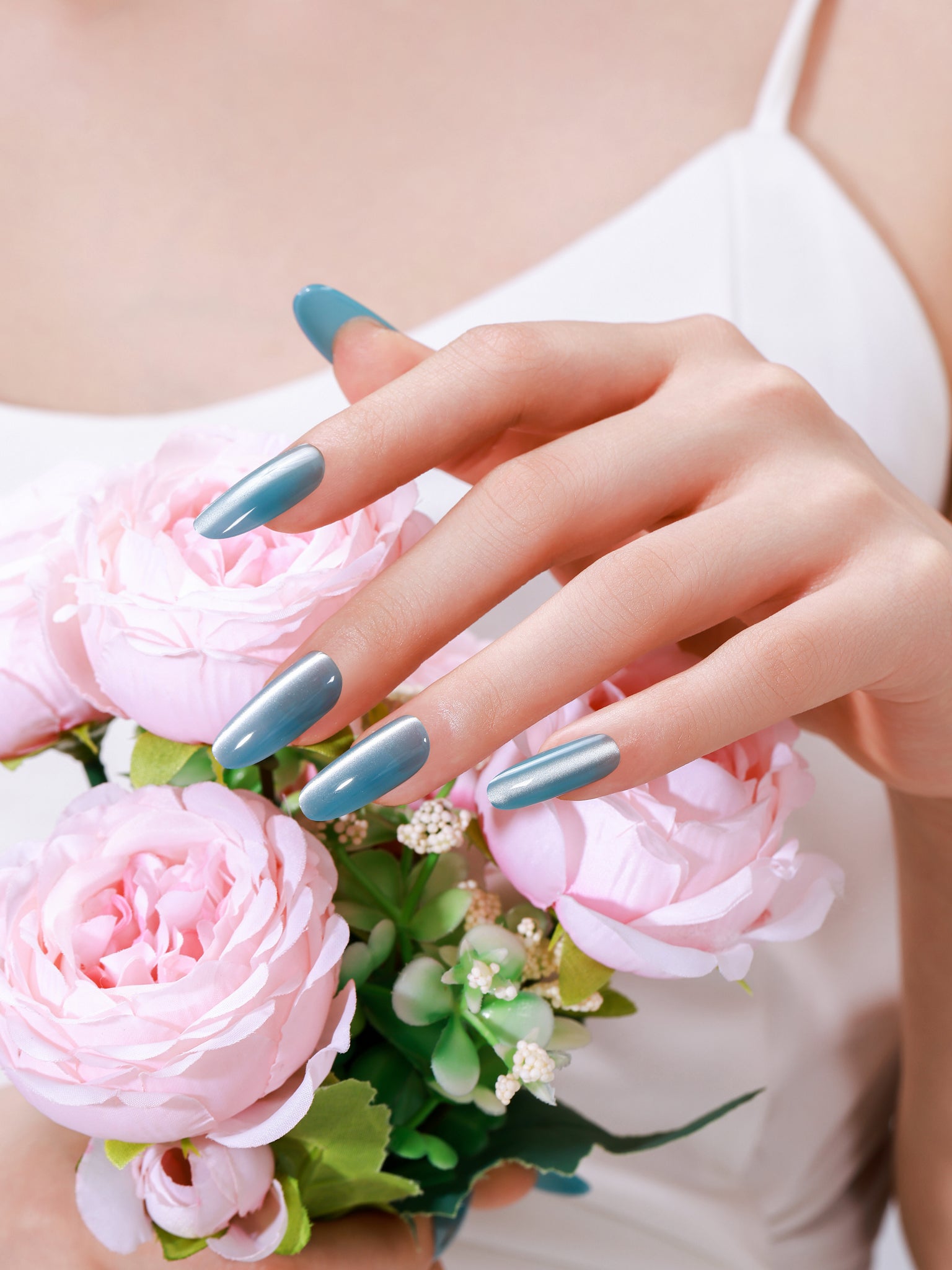 Long oval deep blue cat eye press-on nails with magnetic shimmer gel finish