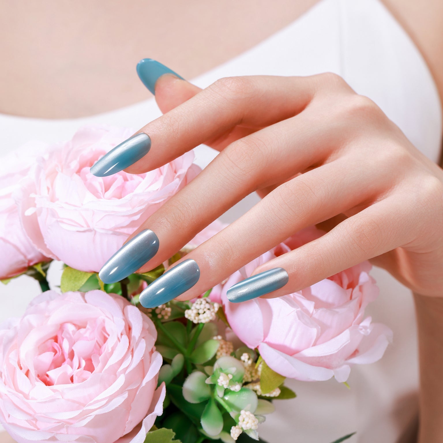 Long oval deep blue cat eye press-on nails with magnetic shimmer gel finish