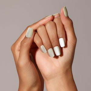 Hand wearing Mint Candy matte pistachio green short square press-on nails minimal clean manicure