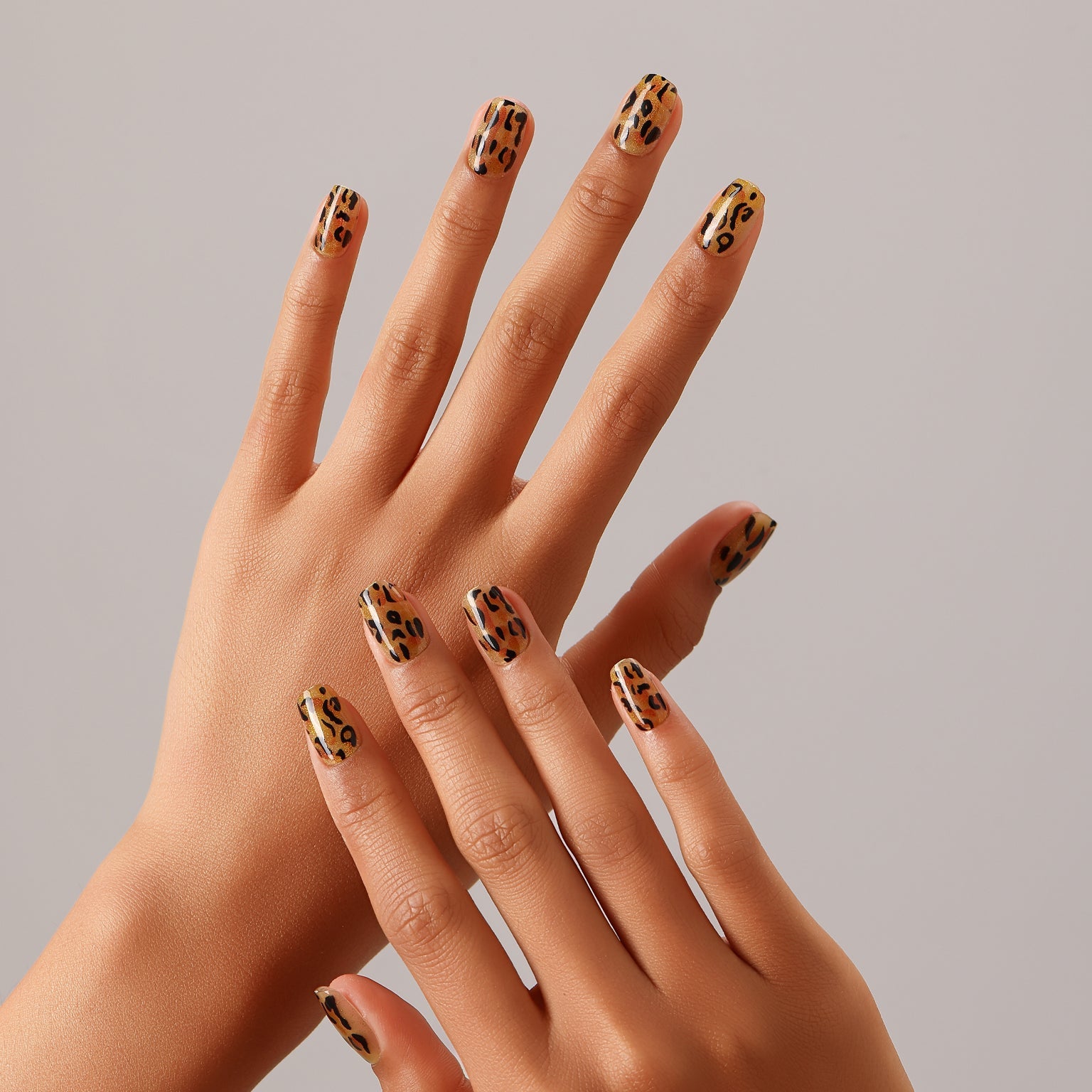Full set showing Sparkle Safari short square animal print press-on nails leopard pattern on all nails