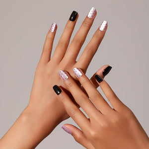 Hand wearing Dot Me Darling short square lavender dotted press-on nails cute minimal nail art