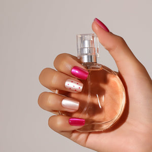Close-up Poppin Rose metallic hot pink press-on nails square shape with pearl blush dotted accent nail