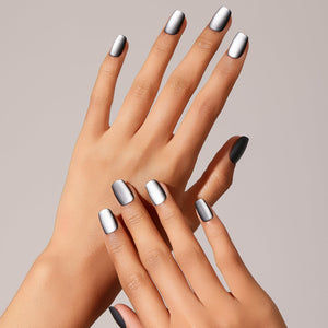 Hand wearing gray matte square press-on nails in an easy everyday length