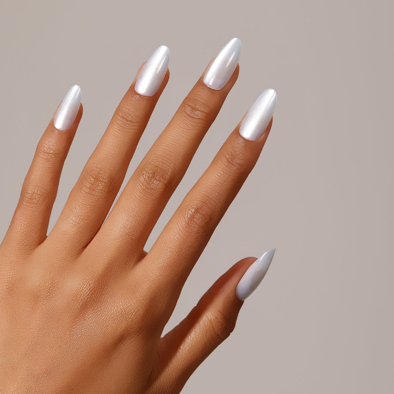 Full set showing Glacier Glow medium almond icy white pearl press-on nails