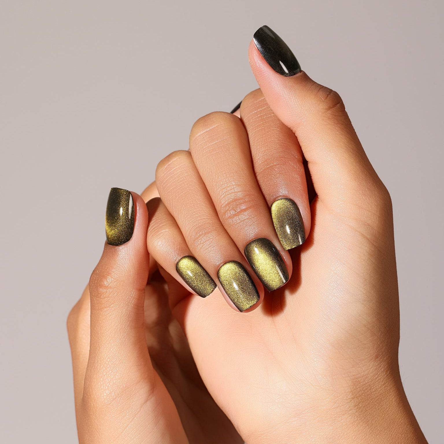 Flat lay Glow Green press-on nails olive gold magnetic cat eye set square shape full design