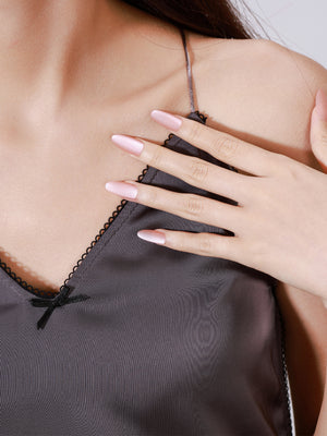 Both hands showing Soft Bloom long stiletto nude chrome acrylic press-on nails elegant manicure