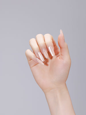 Long oval soft peach press-on nails with glossy gel finish