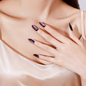 Both hands showing Velvet Flash long almond cat eye press-on nails black and plum night-out look