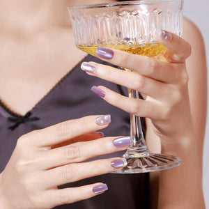 Close-up of Purple Stardust PMMA acrylic short square purple press-on nails with celestial moon and star design