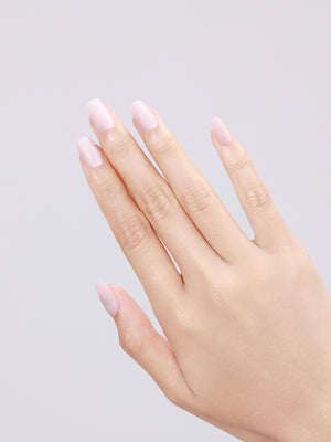 Close-up of Snow Silk short square PMMA acrylic white press-on nails with gel shine