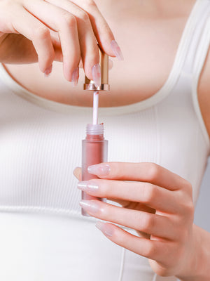 Close up of Cupid Glow pink heart glitter long coffin press on nails from PressPressBeauty