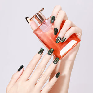 Hand wearing Evil Eyes short square evil eye nails with glossy gel finish