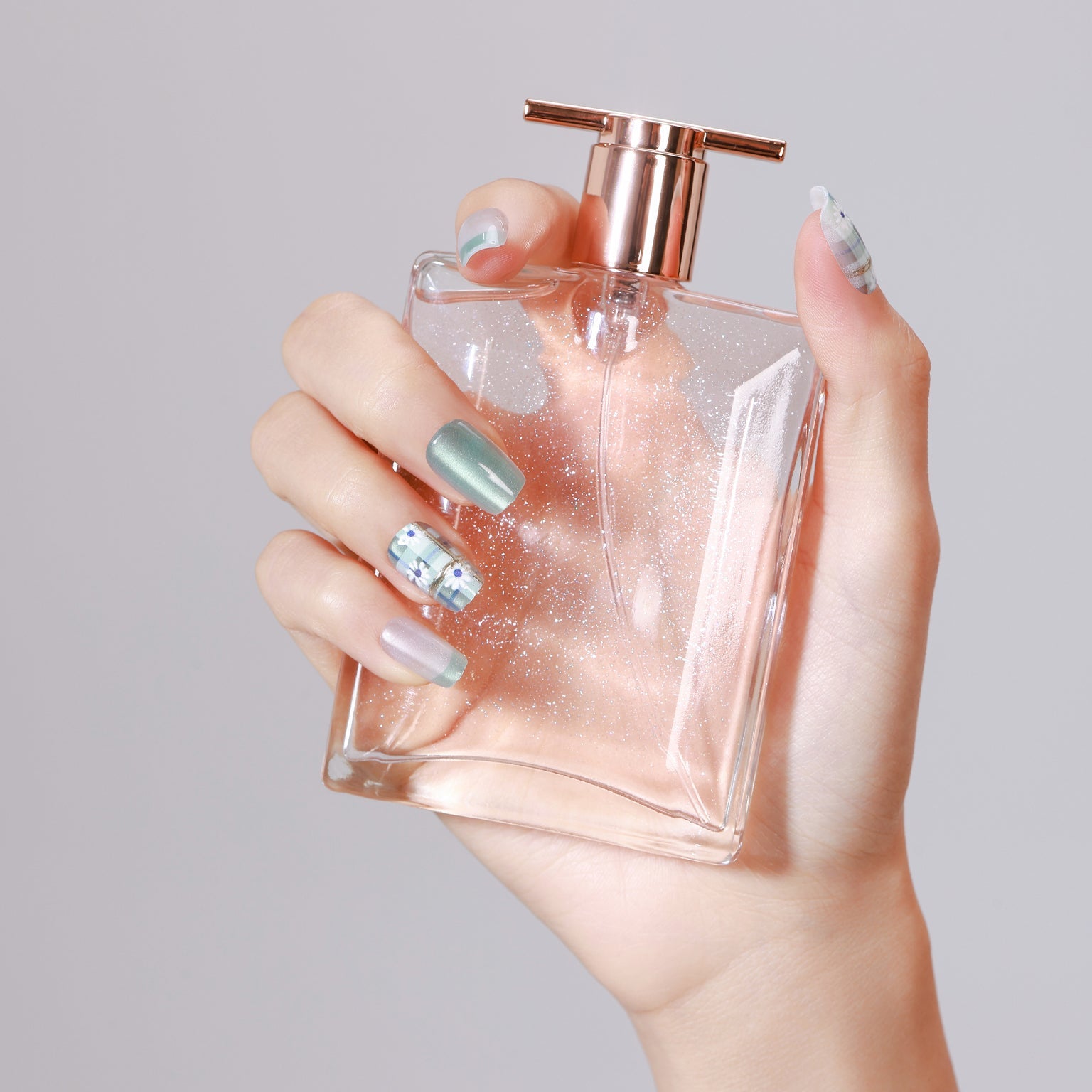 Short square mint shimmer and pearly white press-on nails with green plaid daisy accent nails