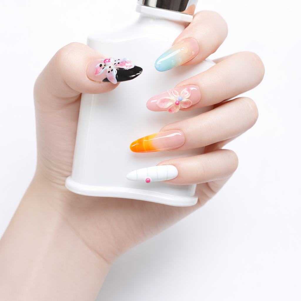 Hand model wearing long almond press on nails with 3D floral nail art, pastel ombre accents, orange French tip and glossy finish